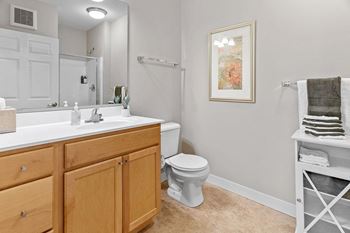 Bathrooms with raised vanities and cultured marble countertops